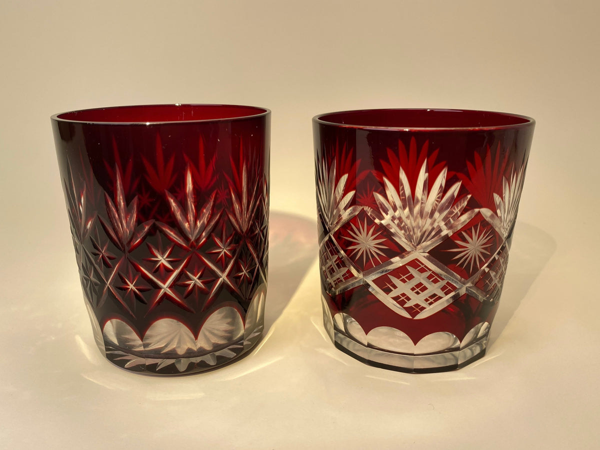 Two Japanese vintage red Kiriko cut glass tumblers, Option A with starburst and crosshatch pattern, Option B with fan and diamond pattern and octagonal base.