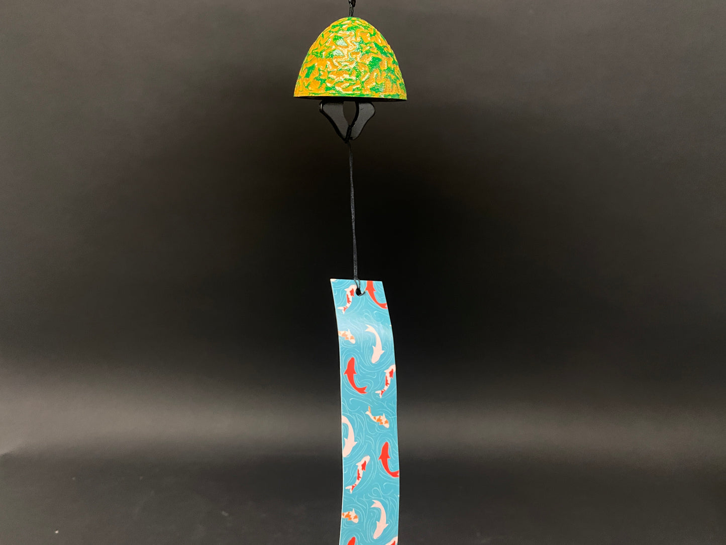 Cast iron wind chime bell with three decorative paper tails including koi fish and cherry blossom patterns